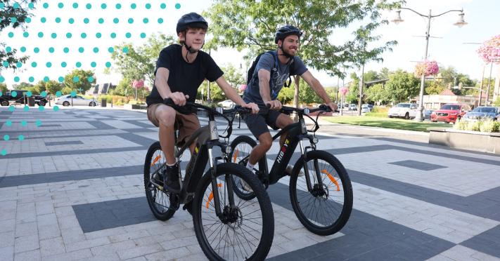 two students on ebikes