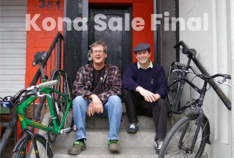 Kona Founders sitting on steps with bikes