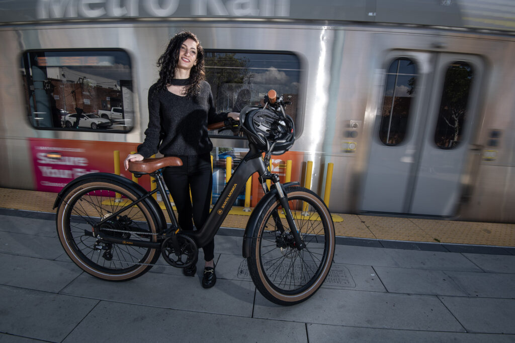 girl and e-bike at subway terminal
